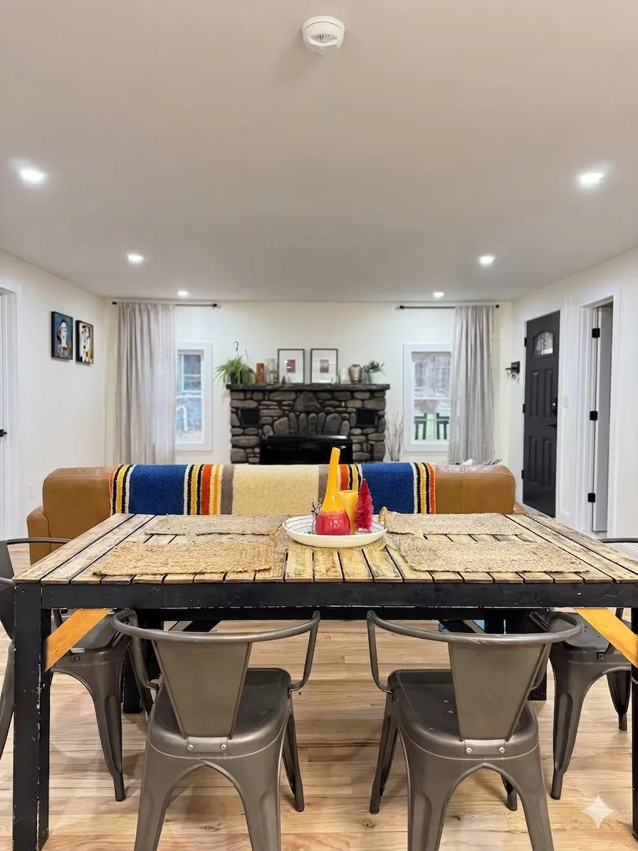 Dining table looking through to the living room fireplace