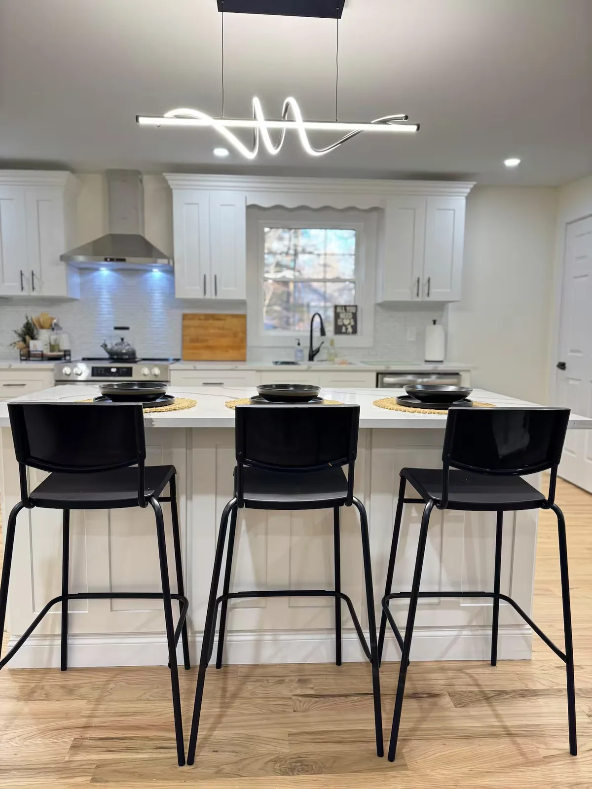Chef's kitchen with quartz island and seating